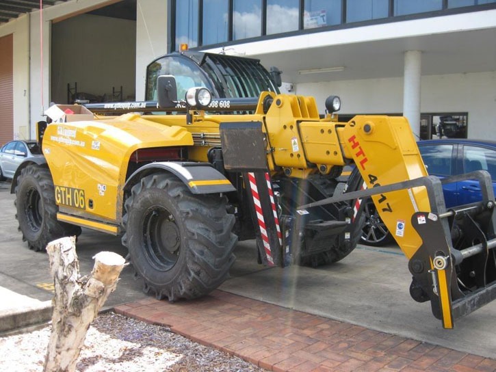 Genie telehandler with an enclosed operator cab.